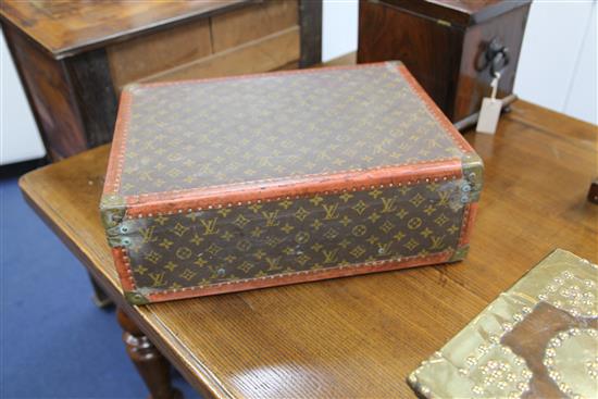 A Louis Vuitton travel case, 19.75 x 14.5 x 7in.